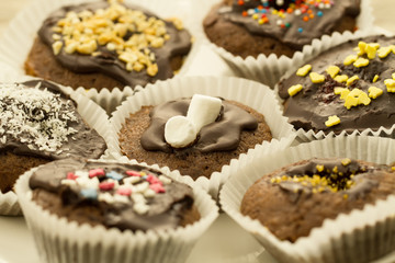 Homemade delicious chocolate cupcakes decorated with a decorative topping