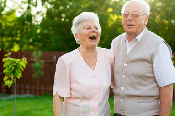 Happy senior woman and man