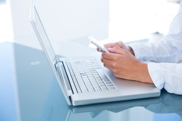 Businesswoman using her smartphone