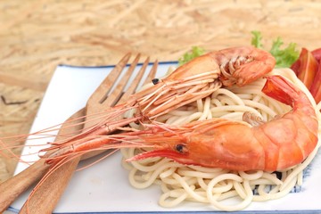 Pasta spaghetti with shrimp on the plate.