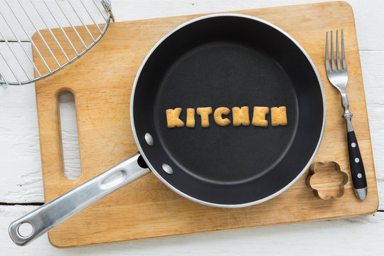 Letter cookies word KITCHEN and kitchen utensils