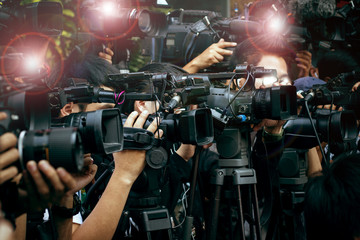 press and media camera ,video photographer on duty in public new - obrazy, fototapety, plakaty