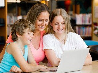 Mother with kids in library