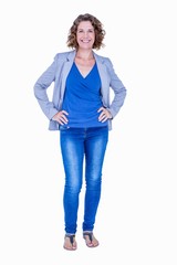 Businesswoman looking at camera with hands on hip 