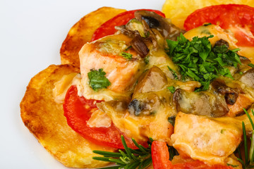 Roasted salmon with potato and tomato