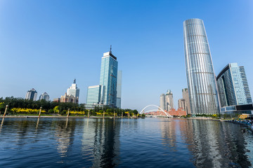Fototapeta na wymiar Modern buildings and river in urban city
