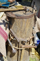 Wooden stand with tools for forging copper sheets.