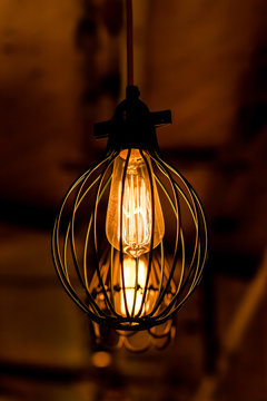 Retro interior light bulb glowing.