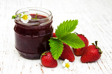 Strawberry jam and fresh strawberries