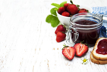 Strawberry jam and fresh strawberries