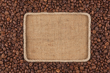 Frame  made of rope with  coffee beans  lying on sacking