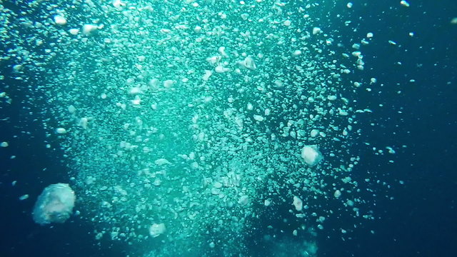Air Bubbles in Blue Ocean Rising from the Deep