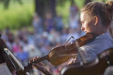 Young woman playing the violin at outdoors © tiplyashina