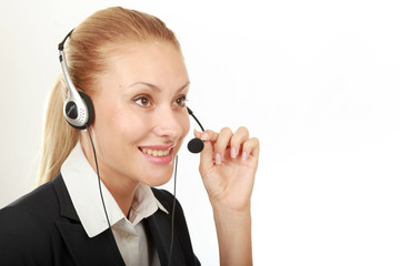 Female call center operator with headphone browsing on her