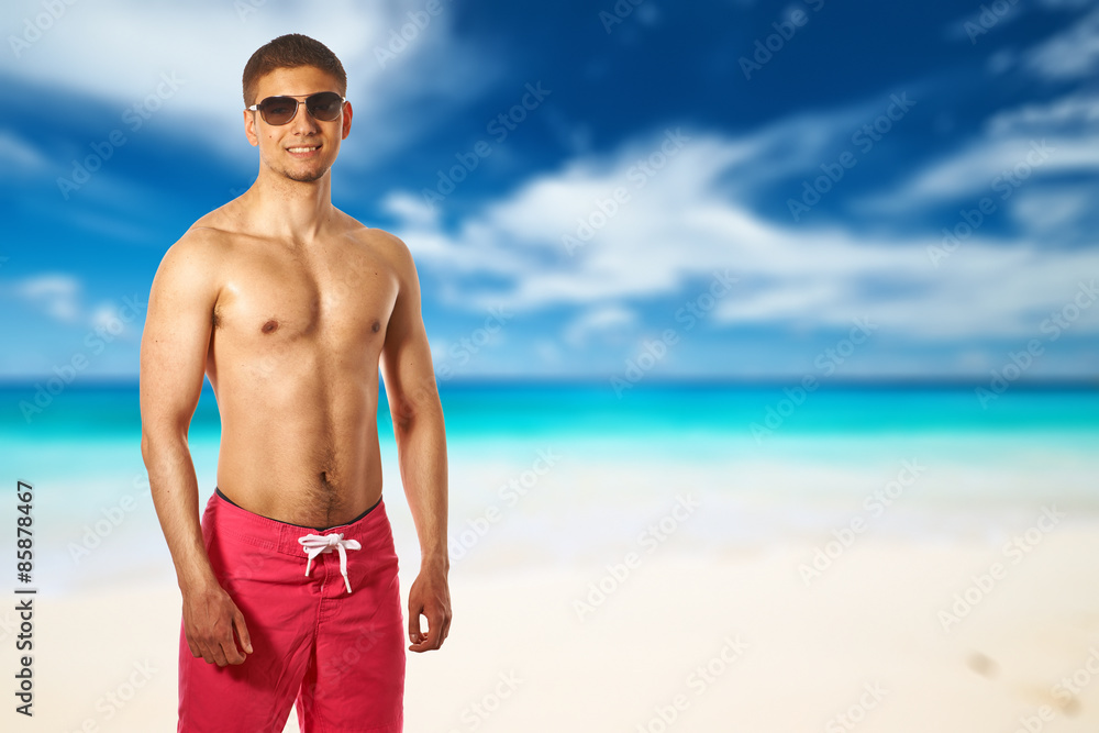 Poster man on anse intendance beach at seychelles