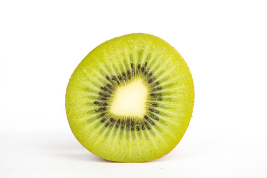 Sliced kiwi fruit on white