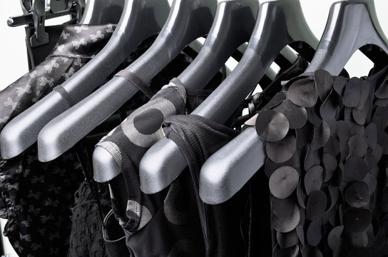 black womens clothing hanging on the black plastic hanger horizo