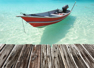 Beautiful island beach with motor boat