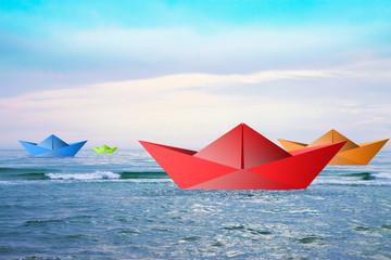 Colored boats on a calm sea - concept image
