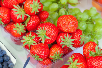 Food market display of strawberries ready to eat.