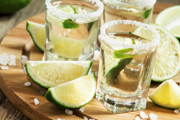 Silver Mexican tequila with lime and salt, selective focus