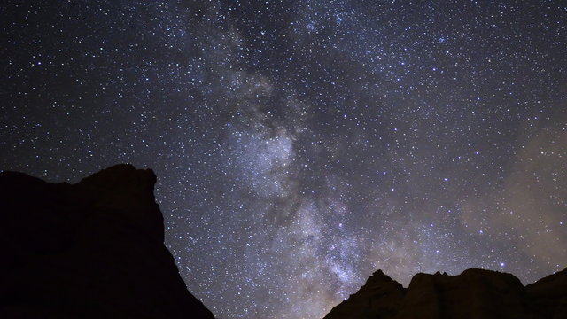  Motion controlled time lapse footage with zoom out motion of milky way galaxy over sandstone formation in Red Rock Canyon State Park, California
