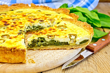 Pie with spinach on the board