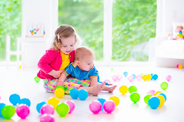 Fototapeta na wymiar Children playing with colorful toys