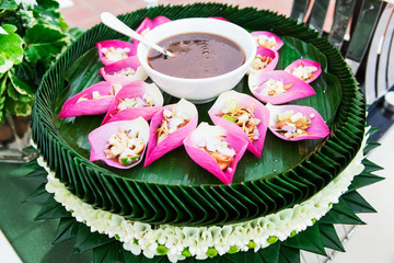 Mix fried rice contained in lotus flower leaf