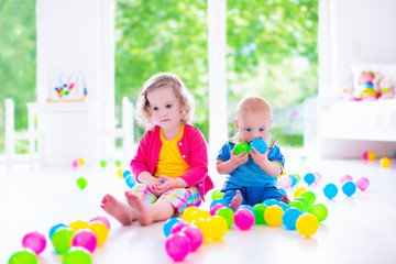 Obraz na płótnie Canvas Children playing with colorful toys
