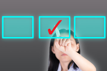 Girl pushing tick symbol  button with computor screen