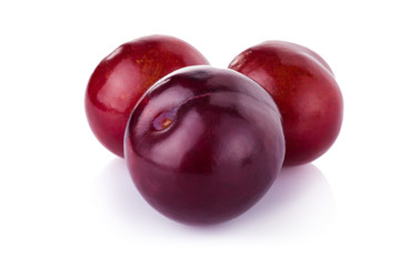 plums isolated on white