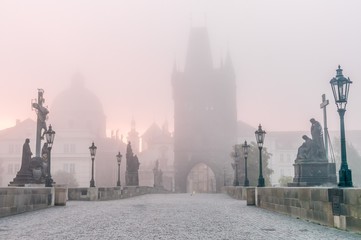 Charles Bridge in Prague at foggy morning