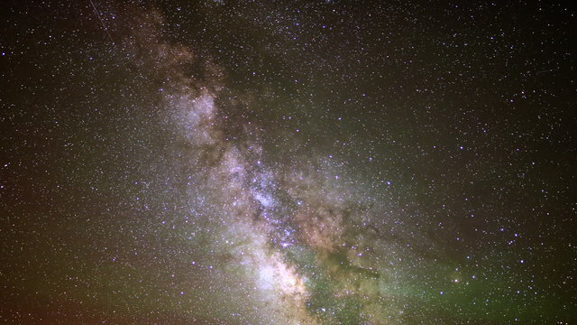  Astrophotography time lapse footage of milky way galaxy over alpine forest in Utah