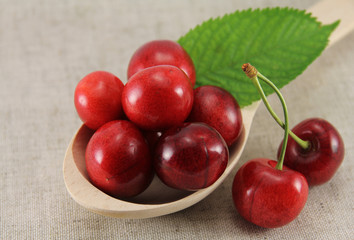 Abstract view cherry in a wooden spoon