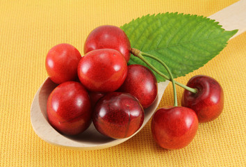 Abstract view cherry in a wooden spoon