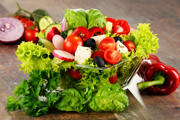 Vegetable salad bowl on kitchen table. Balanced diet