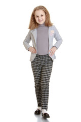 Fototapeta premium Elegant girl schoolgirl in a pantsuit