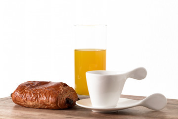 breakfast with chocolate croissant, coffee and orange juice