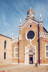 Fototapeta na wymiar Tilt shift photo of church Santa Maria d Oro in Venice. Soft focus