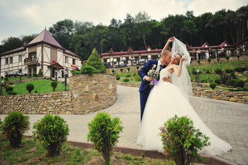 young happy wedding couple at the nice nature