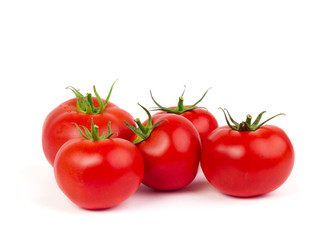 Fresh tomatoes with green leaves isolated on white background