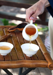 Traditional chinese tea ceremony accessories (cups, pouring tea)
