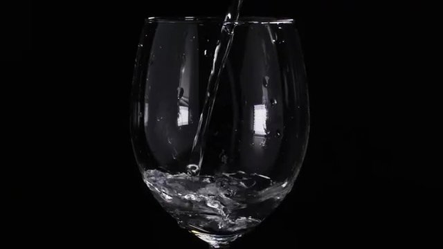 water pouring in wineglass in slow motion 180fps