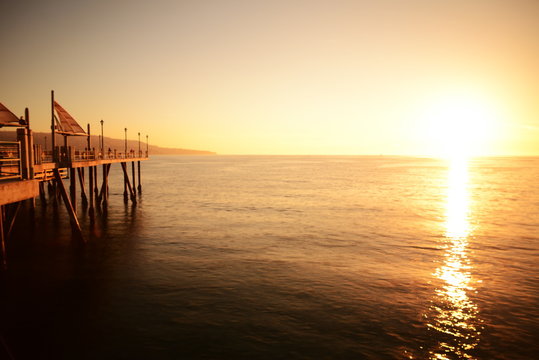  Time lapse footage of the sun setting on horizon at Redondo Pier in California