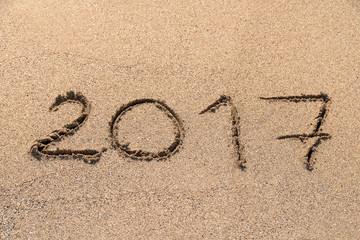 Year 2017 Written On Beach Sand