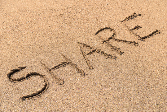 Share Sign On Beach Sand
