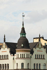 Fototapeta premium The house with a turret and a weather vane