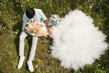 Bride lying on his lap