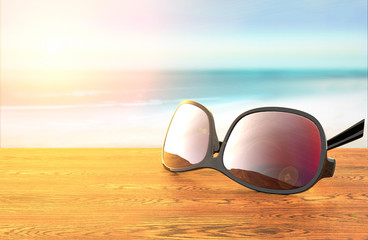 Fototapeta na wymiar Sunglasses on the beach